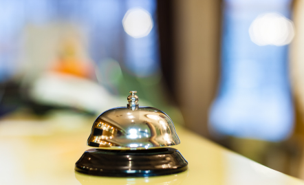bell on hotel reception desk